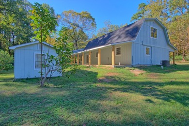 This 2 story beauty backs up to the national forest and is a 3 on Pendleton Harbor in Texas - for sale on GolfHomes.com, golf home, golf lot