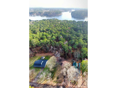 This 2 story beauty backs up to the national forest and is a 3 on Pendleton Harbor in Texas - for sale on GolfHomes.com, golf home, golf lot