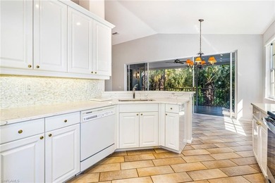 Step into a home that feels equal parts refined and on West Bay Beach and Golf Club in Florida - for sale on GolfHomes.com, golf home, golf lot