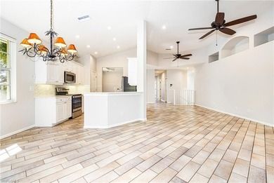 Step into a home that feels equal parts refined and on West Bay Beach and Golf Club in Florida - for sale on GolfHomes.com, golf home, golf lot