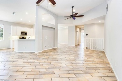 Step into a home that feels equal parts refined and on West Bay Beach and Golf Club in Florida - for sale on GolfHomes.com, golf home, golf lot