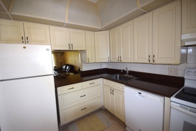 Enjoy serene golf course views and resort-style amenities in on Oriole Golf and Tennis Club in Florida - for sale on GolfHomes.com, golf home, golf lot