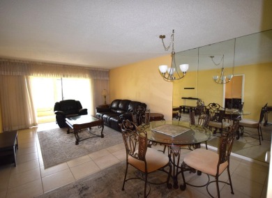 Enjoy serene golf course views and resort-style amenities in on Oriole Golf and Tennis Club in Florida - for sale on GolfHomes.com, golf home, golf lot