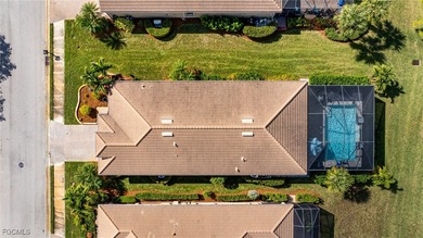 Priced to sell! The stunning saltwater pool is the focal point on Pelican Preserve Golf Club in Florida - for sale on GolfHomes.com, golf home, golf lot