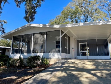 This home in a 55+ Community with manned front gate has been on Water Oak Country Club Estates in Florida - for sale on GolfHomes.com, golf home, golf lot