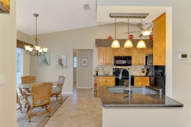 Attractive three bedroom, two bath, pool home, with golf course on Waterford Golf Club in Florida - for sale on GolfHomes.com, golf home, golf lot