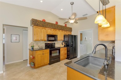 Attractive three bedroom, two bath, pool home, with golf course on Waterford Golf Club in Florida - for sale on GolfHomes.com, golf home, golf lot