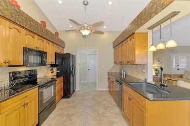 Attractive three bedroom, two bath, pool home, with golf course on Waterford Golf Club in Florida - for sale on GolfHomes.com, golf home, golf lot