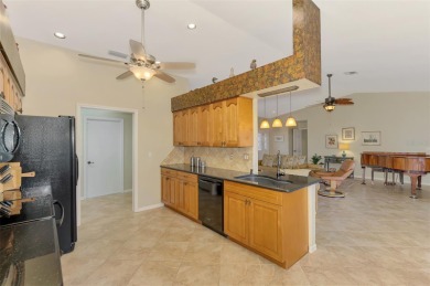 Attractive three bedroom, two bath, pool home, with golf course on Waterford Golf Club in Florida - for sale on GolfHomes.com, golf home, golf lot
