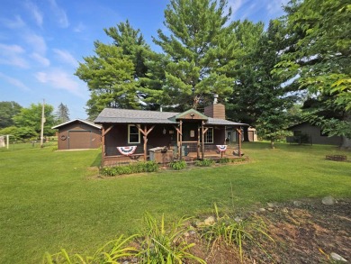 This charming Northwoods-style 1 bed, 1 bath cabin is just on Northern Bay Golf Resort and Marina in Wisconsin - for sale on GolfHomes.com, golf home, golf lot