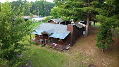 This charming Northwoods-style 1 bed, 1 bath cabin is just on Northern Bay Golf Resort and Marina in Wisconsin - for sale on GolfHomes.com, golf home, golf lot