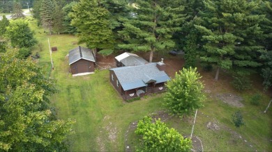 This charming Northwoods-style 1 bed, 1 bath cabin is just on Northern Bay Golf Resort and Marina in Wisconsin - for sale on GolfHomes.com, golf home, golf lot