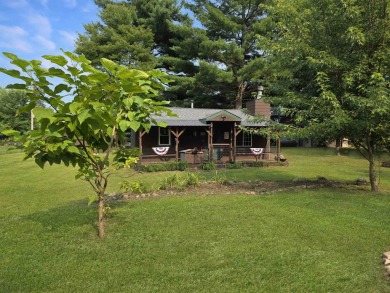 This charming Northwoods-style 1 bed, 1 bath cabin is just on Northern Bay Golf Resort and Marina in Wisconsin - for sale on GolfHomes.com, golf home, golf lot