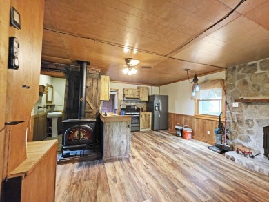 This charming Northwoods-style 1 bed, 1 bath cabin is just on Northern Bay Golf Resort and Marina in Wisconsin - for sale on GolfHomes.com, golf home, golf lot