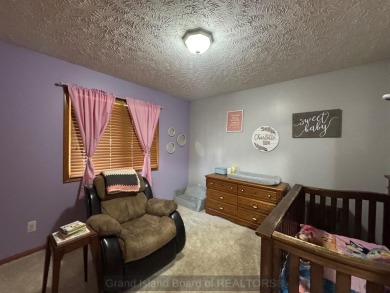 This beautiful home is located right by Indianhead Golf Course! on Indianhead Golf Club in Nebraska - for sale on GolfHomes.com, golf home, golf lot