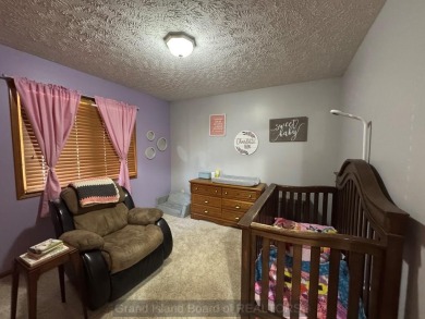 This beautiful home is located right by Indianhead Golf Course! on Indianhead Golf Club in Nebraska - for sale on GolfHomes.com, golf home, golf lot