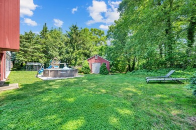 Set on a generous half-acre corner lot, this 3,400 sq ft home on Ailing Memorial Golf Course in Connecticut - for sale on GolfHomes.com, golf home, golf lot