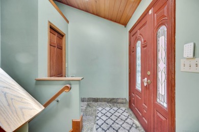 Set on a generous half-acre corner lot, this 3,400 sq ft home on Ailing Memorial Golf Course in Connecticut - for sale on GolfHomes.com, golf home, golf lot