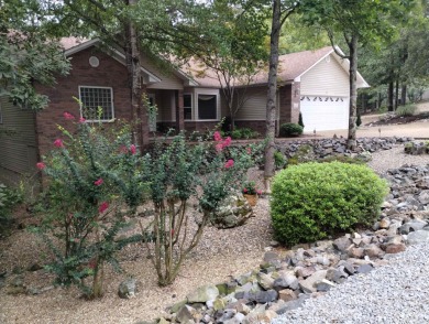 Great curb appeal with additional landscaping in this on Ponce De Leon Golf Course in Arkansas - for sale on GolfHomes.com, golf home, golf lot