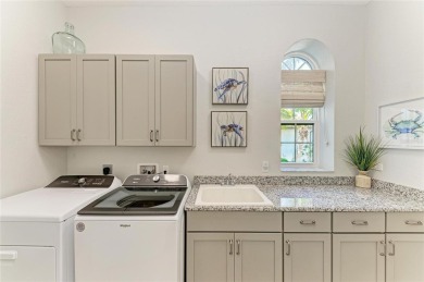 Come see this beautiful custom home in the cherished Legends Bay on IMG Academies Golf and Country Club in Florida - for sale on GolfHomes.com, golf home, golf lot