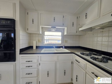 All you want is a cozy, comfortable place to live that is easy on Desert Crest Country Club in California - for sale on GolfHomes.com, golf home, golf lot