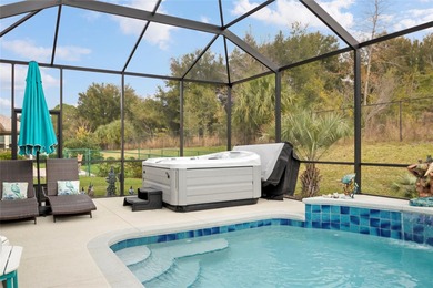 SPECTACULAR 3/2 Sycamore with a SALTWATER POOL, large screened on Stonecrest Golf and Club Club in Florida - for sale on GolfHomes.com, golf home, golf lot