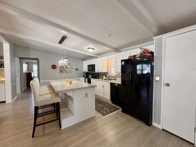 Move-In Ready 55+ Coastal Retreat with Water Views--short golf on Indigo Creek Golf Club in South Carolina - for sale on GolfHomes.com, golf home, golf lot