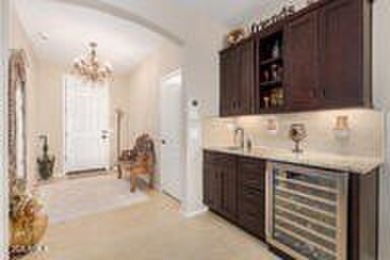 Exceptional Golf Course Home with Private Pool  Designer Kitchen on Poston Butte Golf Club in Arizona - for sale on GolfHomes.com, golf home, golf lot