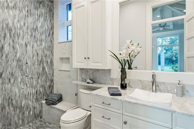 Discover refined coastal luxury in this exceptional estate on Club at Pelican Bay Golf Course in Florida - for sale on GolfHomes.com, golf home, golf lot