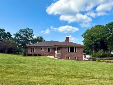 Welcome to this extraordinary all-brick estate, perfectly on Pine Island Country Club in North Carolina - for sale on GolfHomes.com, golf home, golf lot