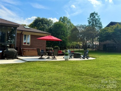 Welcome to this extraordinary all-brick estate, perfectly on Pine Island Country Club in North Carolina - for sale on GolfHomes.com, golf home, golf lot