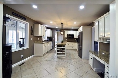 This beautiful brick home in Warwick Hills Golf Community offers on Warwick Hills Golf and Country Club in Michigan - for sale on GolfHomes.com, golf home, golf lot