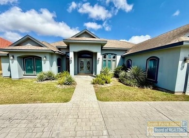 Stunning 3-bedroom 3.5-bathroom lakefront home offers the on South Padre Island Golf Club in Texas - for sale on GolfHomes.com, golf home, golf lot