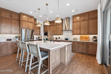 Pool home with a spa & panoramic views of the White Tank on Verrado Golf Club  in Arizona - for sale on GolfHomes.com, golf home, golf lot