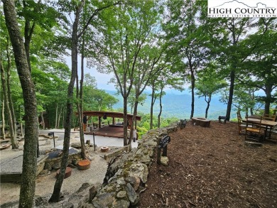 Embrace luxurious mountain living on this rare 5-acre lot with on Beech Mountain Club in North Carolina - for sale on GolfHomes.com, golf home, golf lot