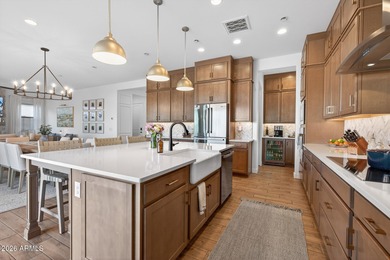 Pool home with a spa & panoramic views of the White Tank on Verrado Golf Club  in Arizona - for sale on GolfHomes.com, golf home, golf lot