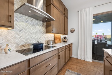 Pool home with a spa & panoramic views of the White Tank on Verrado Golf Club  in Arizona - for sale on GolfHomes.com, golf home, golf lot