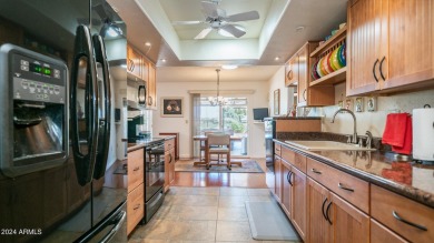 Beautiful, well-maintained home is situated on a serene golf on PalmBrook Country Club in Arizona - for sale on GolfHomes.com, golf home, golf lot