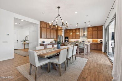 Pool home with a spa & panoramic views of the White Tank on Verrado Golf Club  in Arizona - for sale on GolfHomes.com, golf home, golf lot