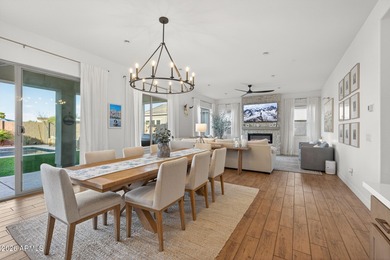 Pool home with a spa & panoramic views of the White Tank on Verrado Golf Club  in Arizona - for sale on GolfHomes.com, golf home, golf lot