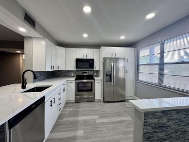 FOR SALE- Step into style and comfort with this beautifully on Wynmoor Golf Course in Florida - for sale on GolfHomes.com, golf home, golf lot
