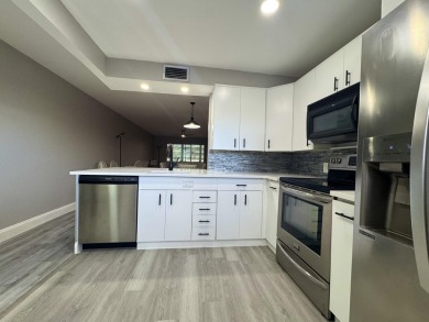 FOR SALE- Step into style and comfort with this beautifully on Wynmoor Golf Course in Florida - for sale on GolfHomes.com, golf home, golf lot
