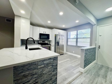 FOR SALE- Step into style and comfort with this beautifully on Wynmoor Golf Course in Florida - for sale on GolfHomes.com, golf home, golf lot