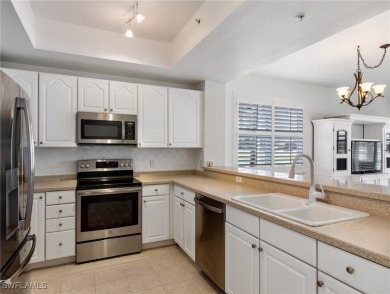 Nestled up to stunning waterfront and golf course views in the on Miromar Lakes Golf Club in Florida - for sale on GolfHomes.com, golf home, golf lot