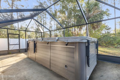 This 3-bedroom, 2-bath home in Palm Coast, is full of potential on The Grand Club Cypress Course in Florida - for sale on GolfHomes.com, golf home, golf lot