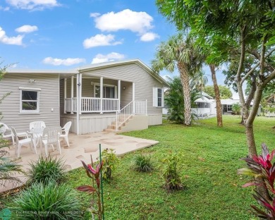 Discover your dream home in this beautifully renovated 3 bedroom on Davie Golf Club in Florida - for sale on GolfHomes.com, golf home, golf lot