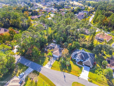This 3-bedroom, 2-bath home in Palm Coast, is full of potential on The Grand Club Cypress Course in Florida - for sale on GolfHomes.com, golf home, golf lot