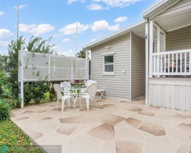 Discover your dream home in this beautifully renovated 3 bedroom on Davie Golf Club in Florida - for sale on GolfHomes.com, golf home, golf lot