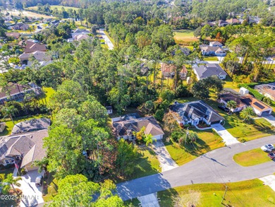 This 3-bedroom, 2-bath home in Palm Coast, is full of potential on The Grand Club Cypress Course in Florida - for sale on GolfHomes.com, golf home, golf lot
