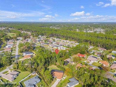 This 3-bedroom, 2-bath home in Palm Coast, is full of potential on The Grand Club Cypress Course in Florida - for sale on GolfHomes.com, golf home, golf lot